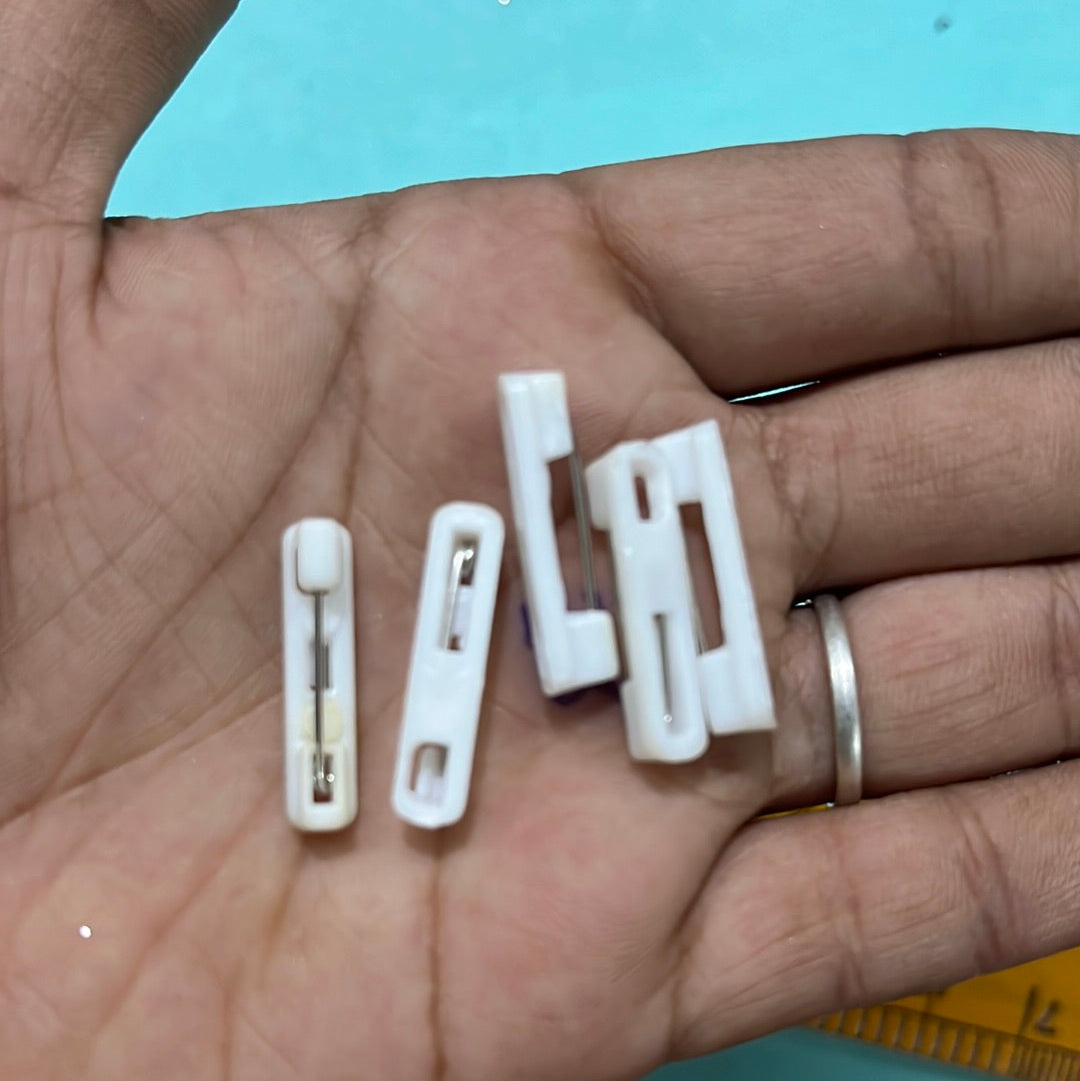 White plain plastic badge pins  8 piece