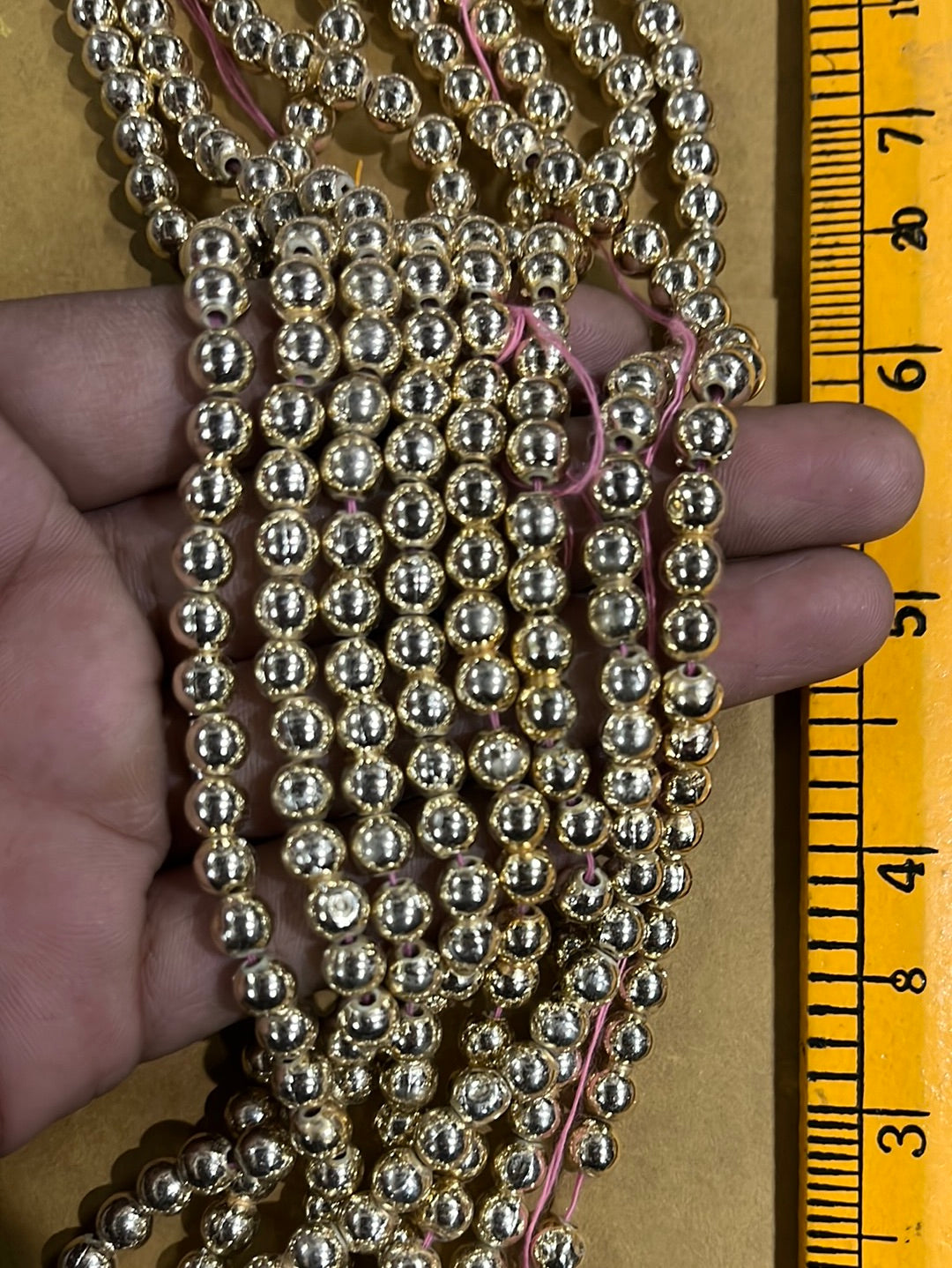 Gold  beads 6mm-500 beads in a punch