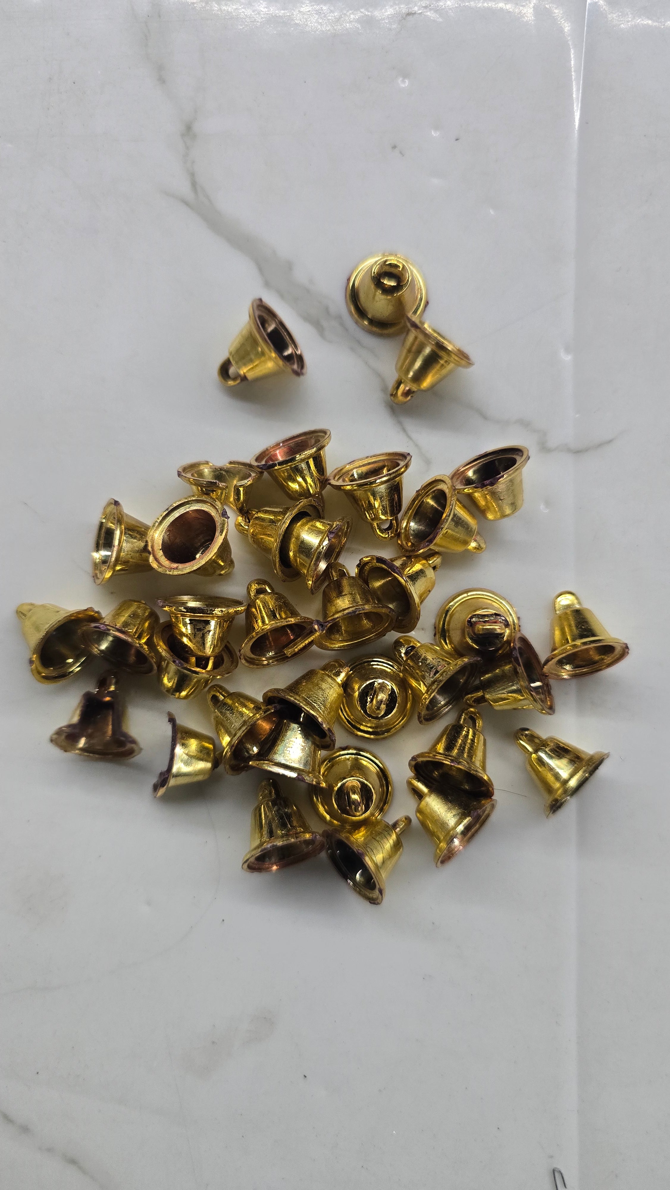 Plastic golden bells small size 50g pack- sbel