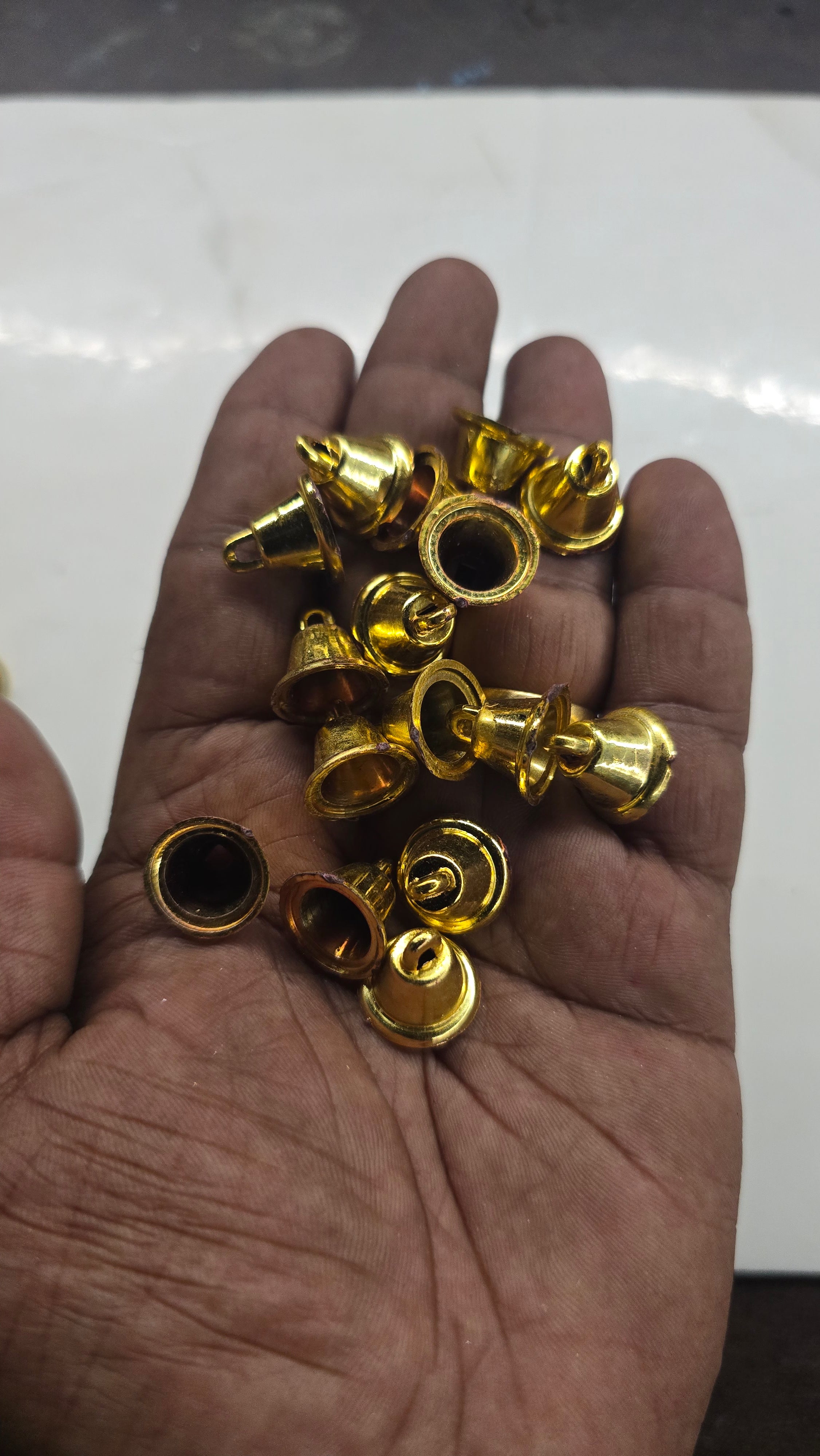 Plastic golden bells small size 50g pack- sbel