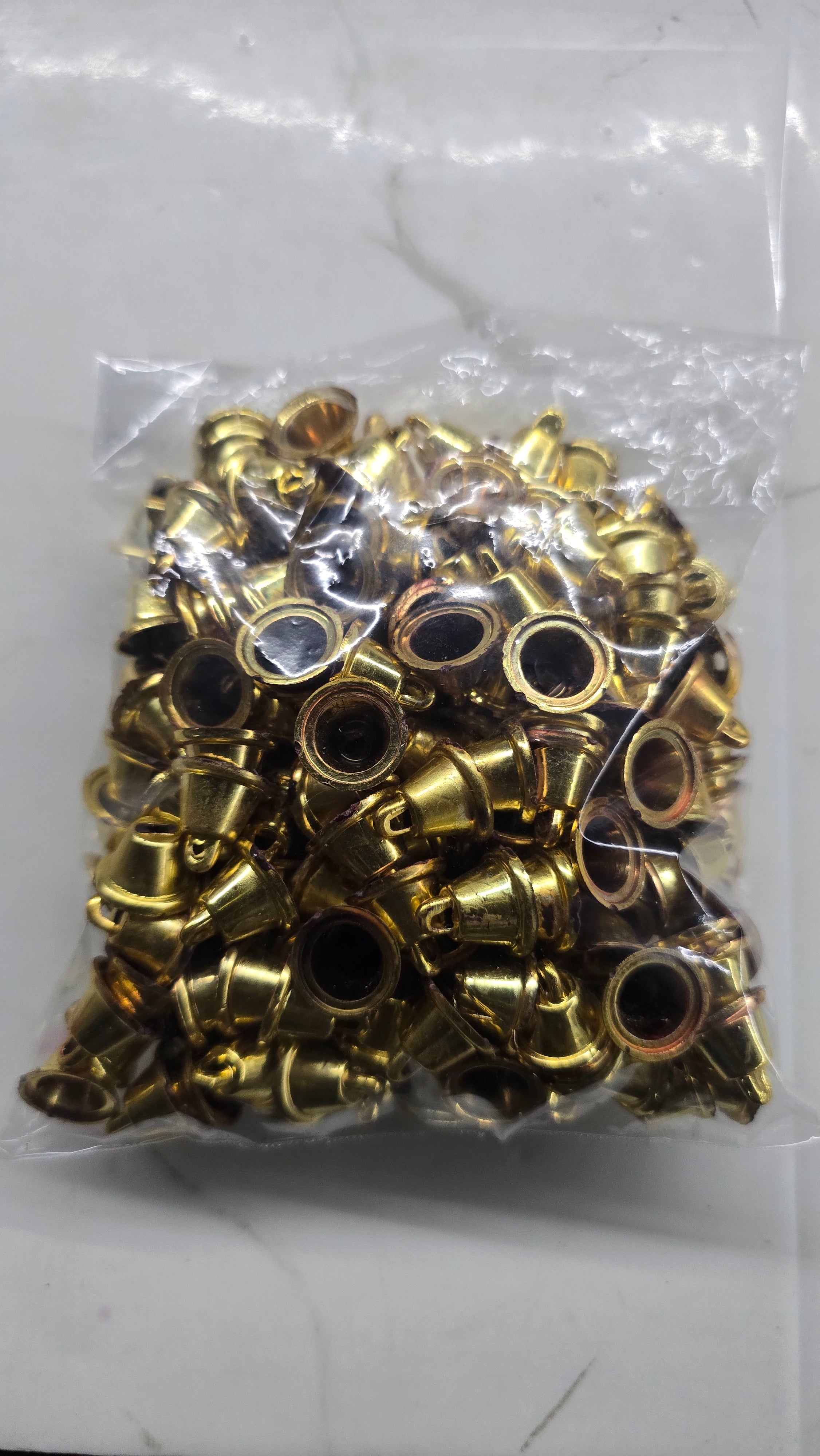 Plastic golden bells small size 50g pack- sbel