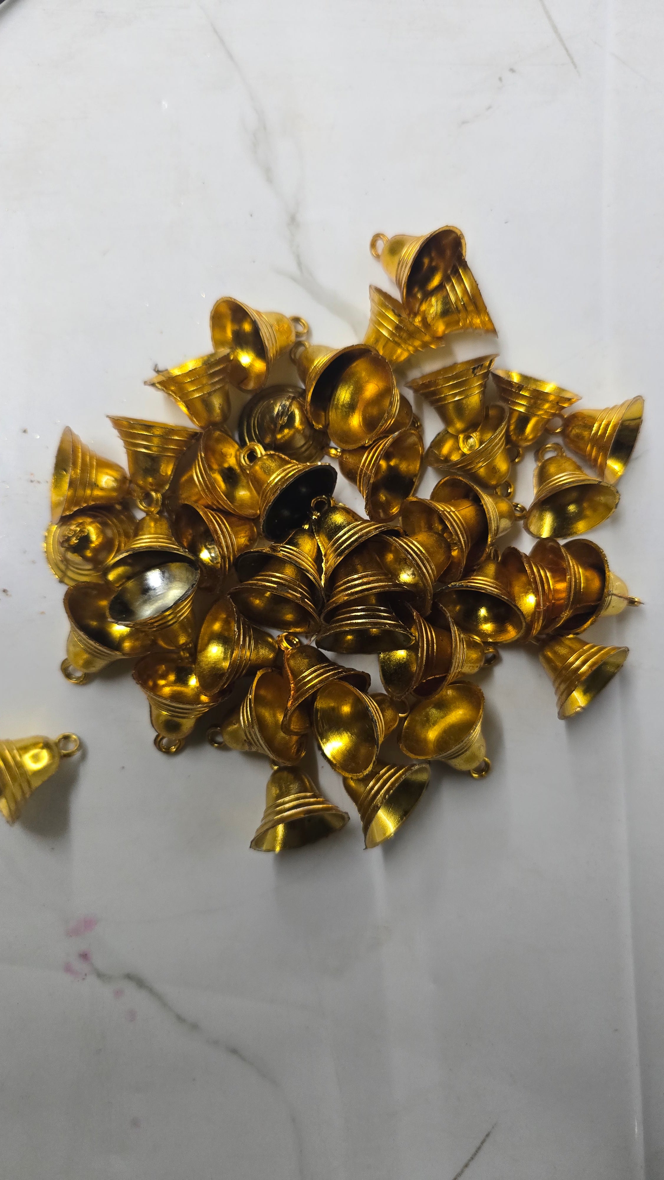 Plastic golden bells medium size 50g pack- sbel