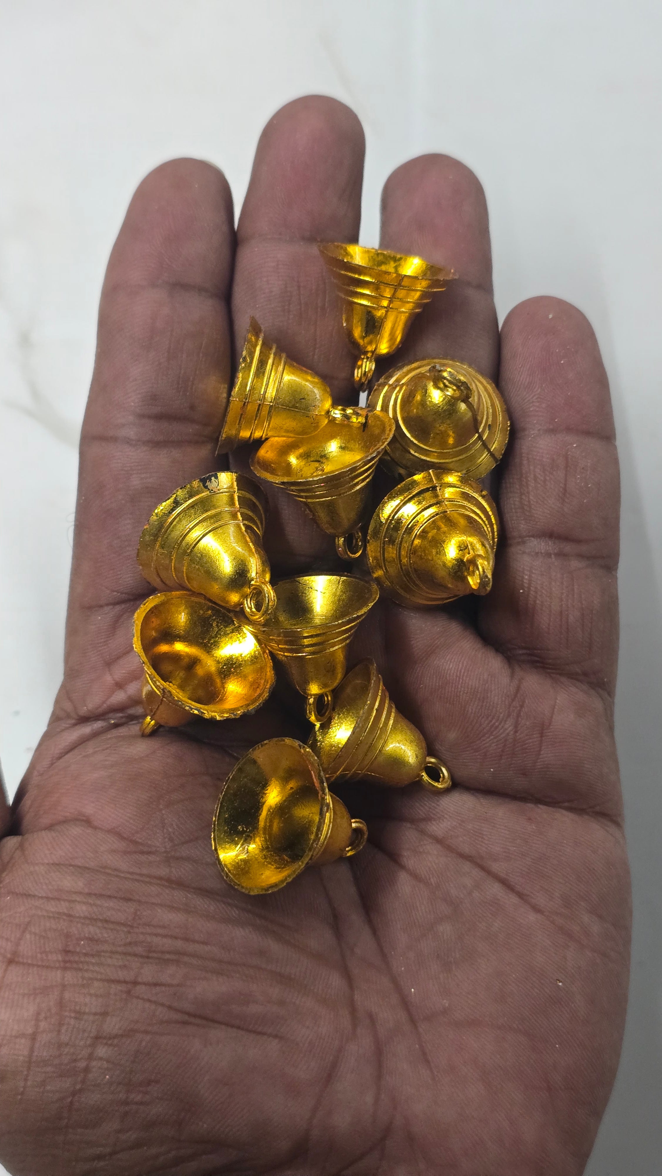 Plastic golden bells medium size 50g pack- sbel