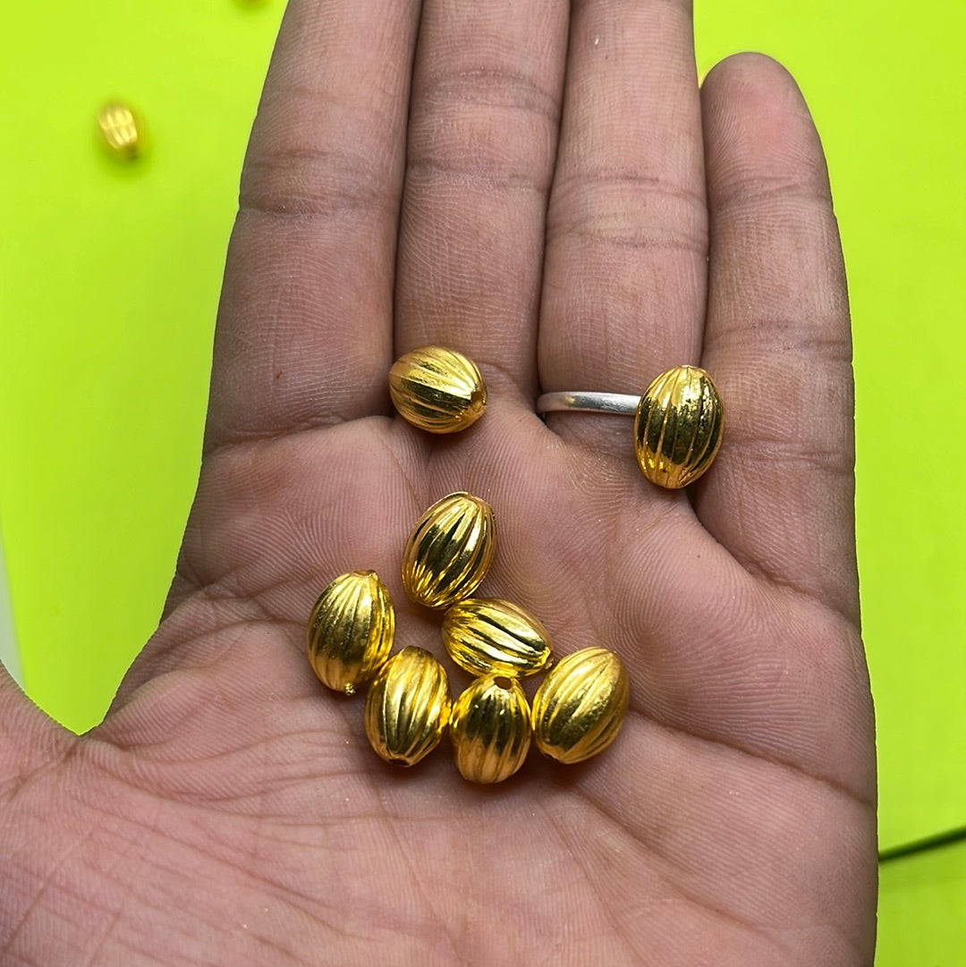 Long gold oval  beads more than 25pc