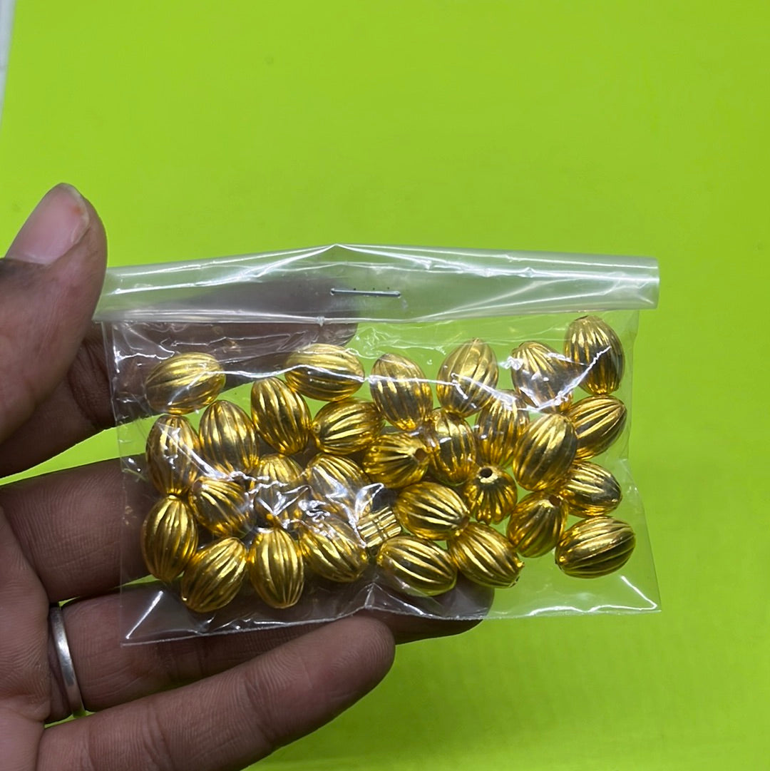 Long gold oval  beads more than 25pc