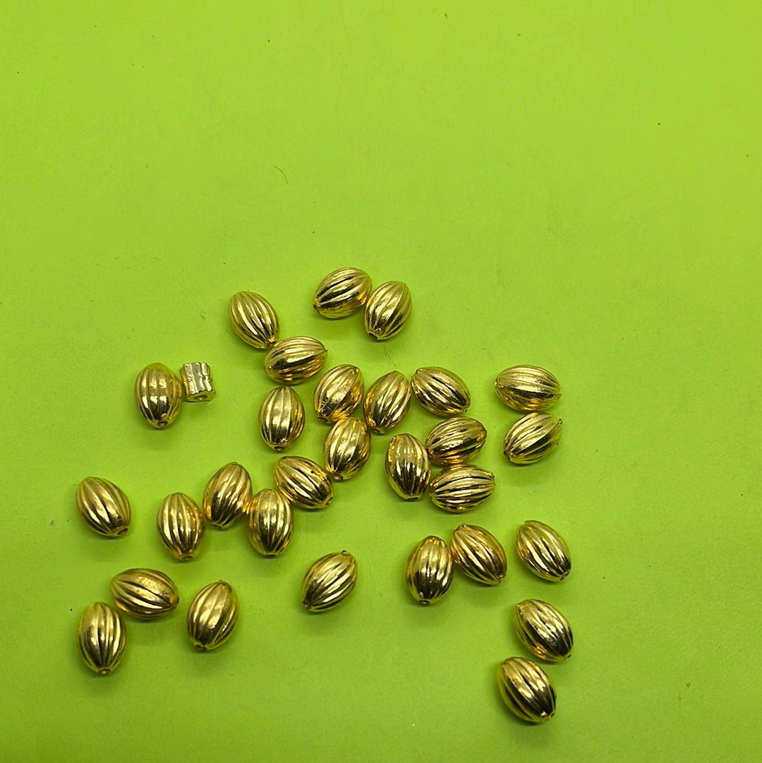 Long gold oval  beads more than 25pc