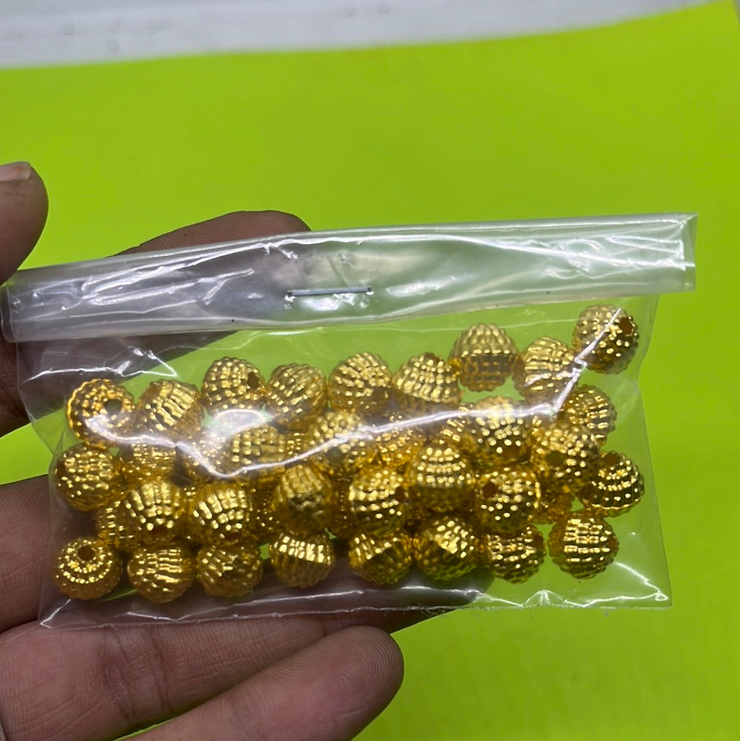 Golden color round ridged plastic beads more than 25pc