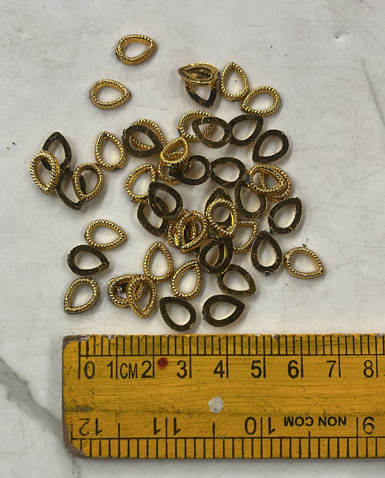 Golden Acrylic frame for kundan stone -25g pack assorted designs approximate 50pieces