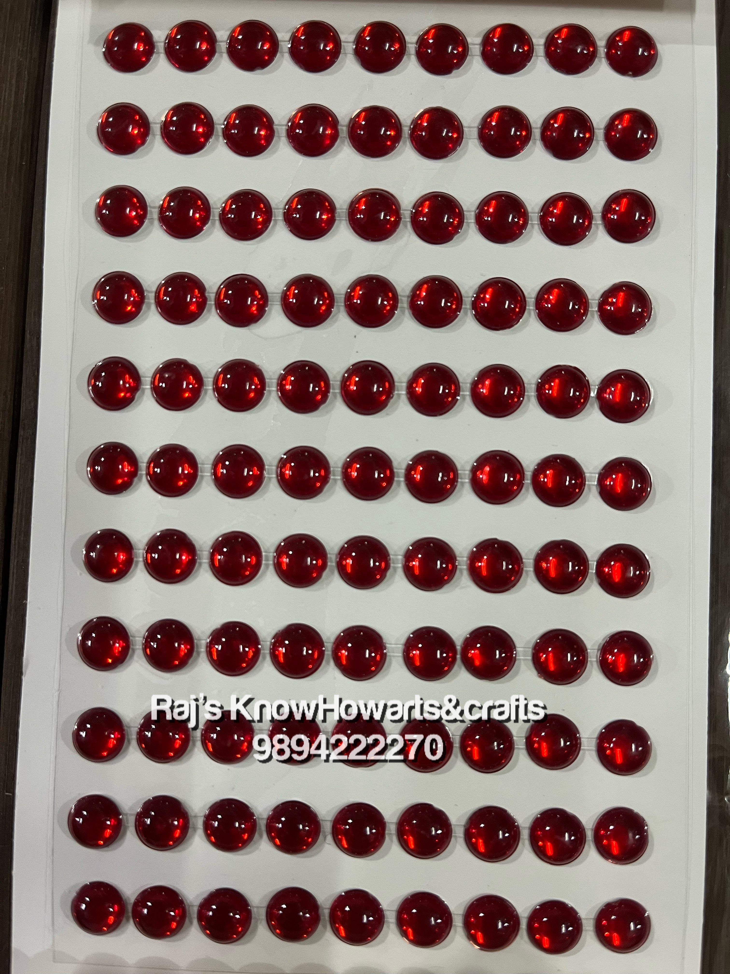 Red coloured round  shape stone stickers