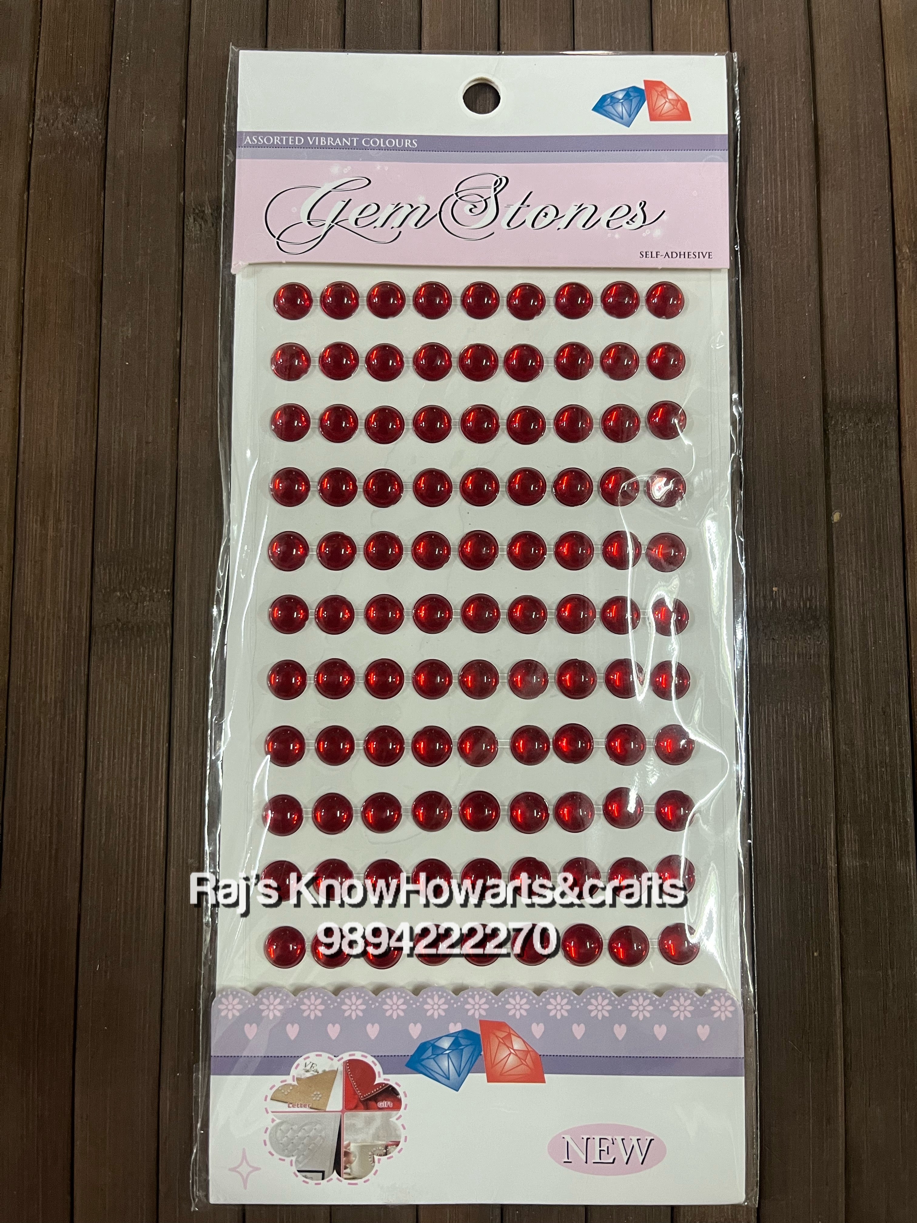 Red coloured round  shape stone stickers