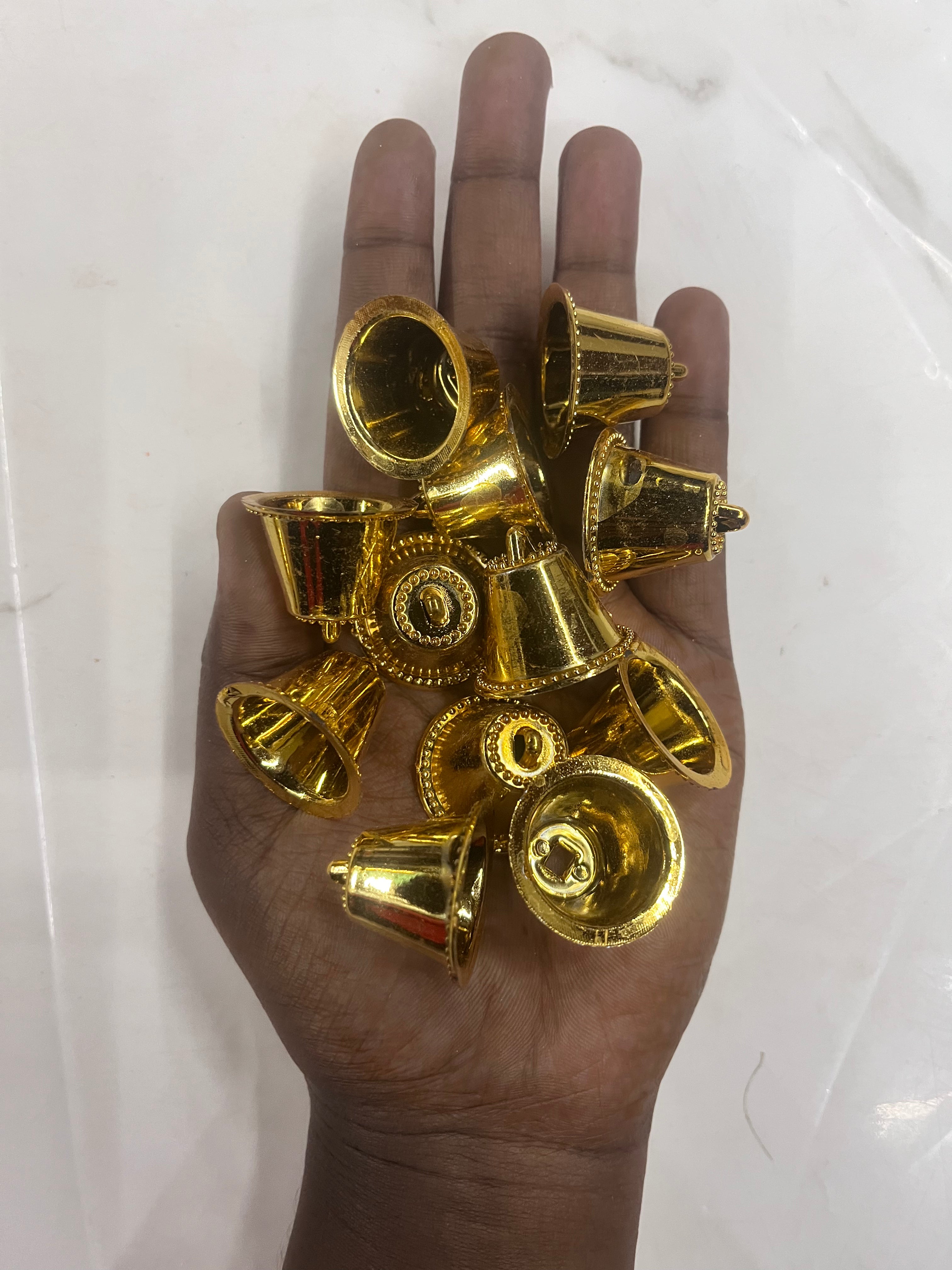 Plastic golden bells small size 50g pack- sbel